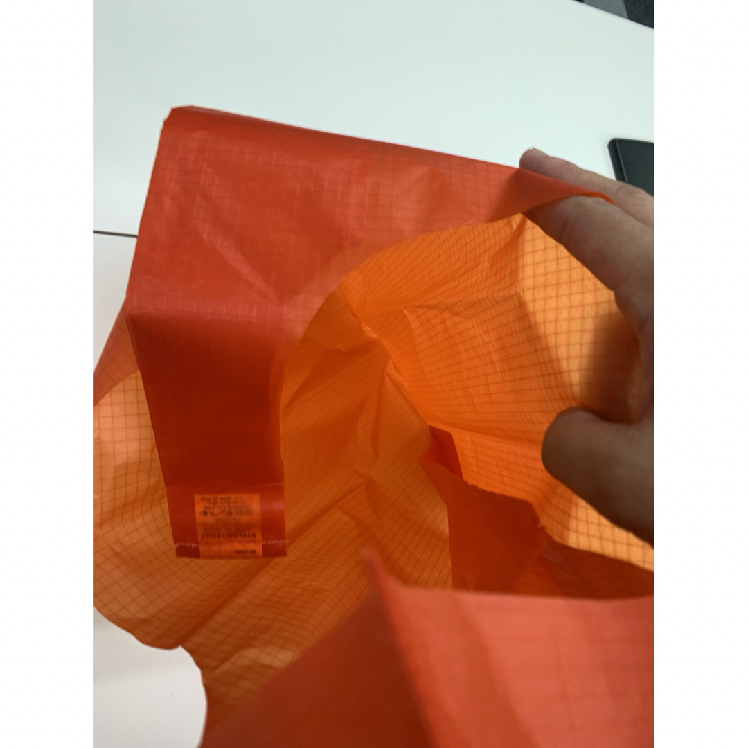 mont bell(モンベル)の【モンベル】フラットバッグ　オレンジ　Lサイズ レディースのバッグ(トートバッグ)の商品写真