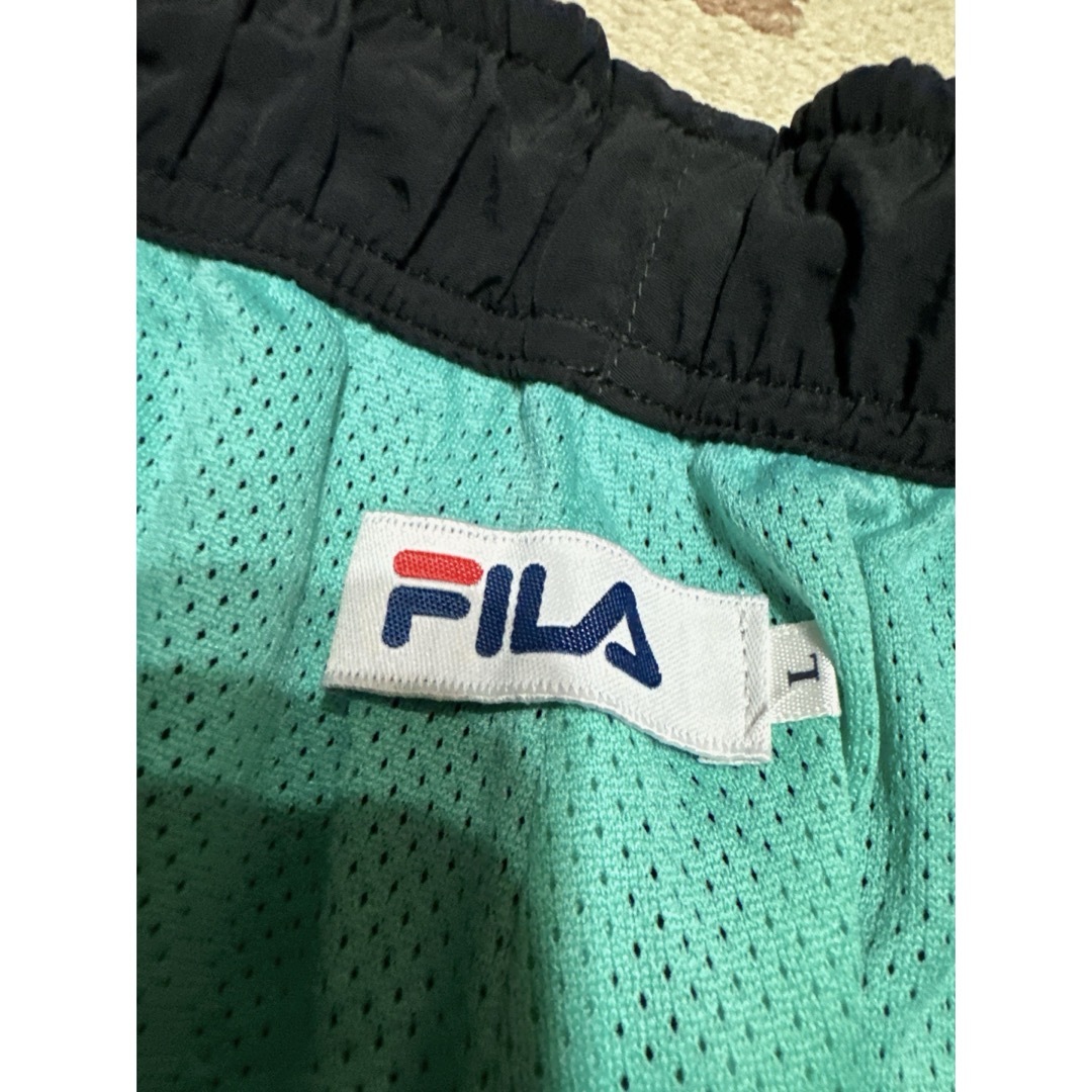 XLARGE(エクストララージ)のエクストララージ × FILA ナイロンパンツ メンズのパンツ(ワークパンツ/カーゴパンツ)の商品写真