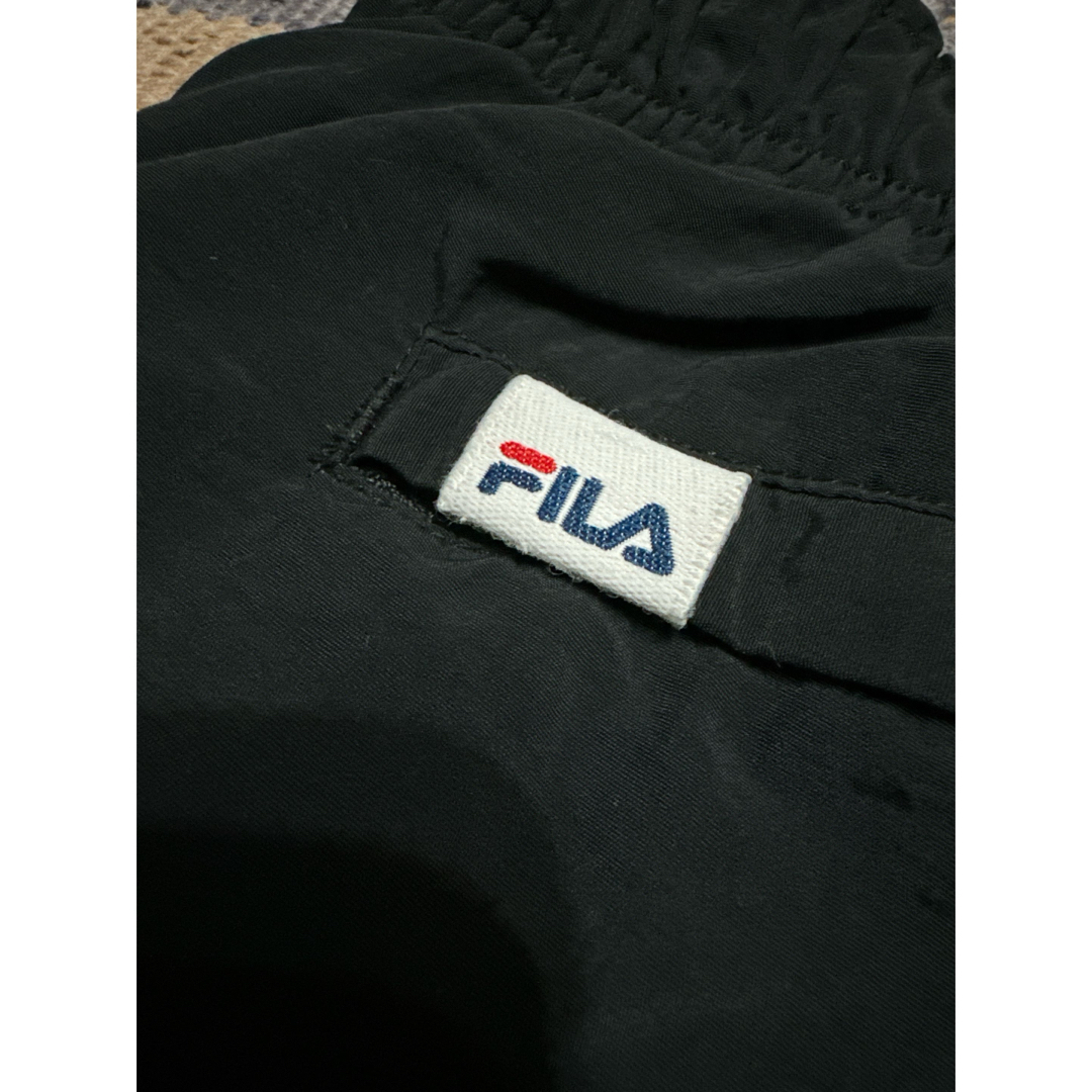 XLARGE(エクストララージ)のエクストララージ × FILA ナイロンパンツ メンズのパンツ(ワークパンツ/カーゴパンツ)の商品写真