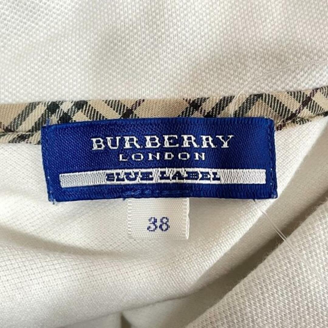 BURBERRY BLUE LABEL(バーバリーブルーレーベル)のBurberry Blue Label(バーバリーブルーレーベル) 半袖ポロシャツ サイズ38 M レディース美品  - 白 レディースのトップス(ポロシャツ)の商品写真