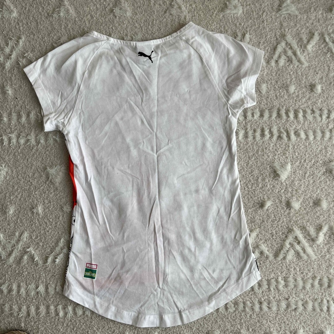 PUMA(プーマ)のセサミストリートTシャツ キッズ/ベビー/マタニティのキッズ服女の子用(90cm~)(Tシャツ/カットソー)の商品写真