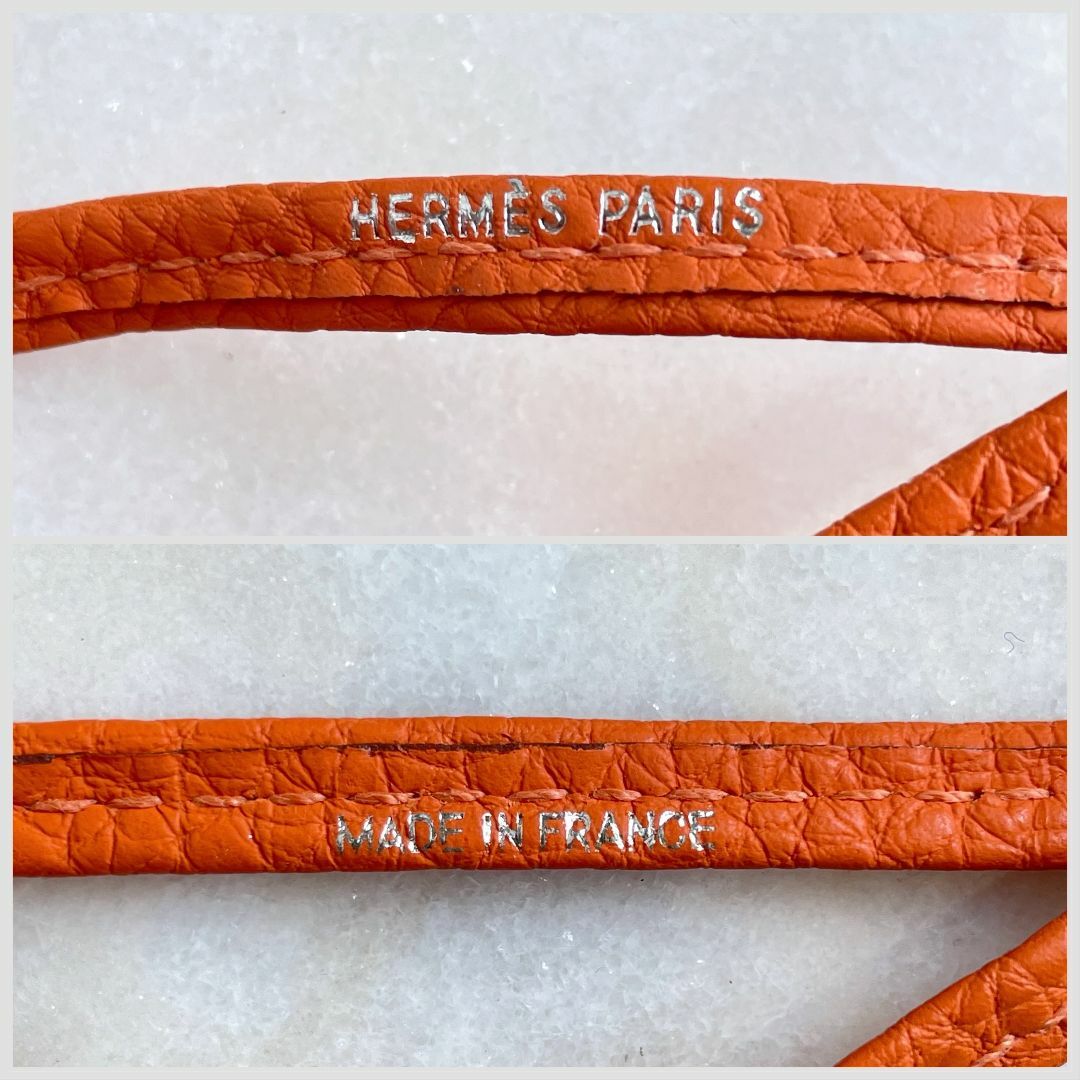 Hermes(エルメス)のHERMES エルメス ホイッスル シフレ オレンジ 犬笛 ネックレス 本革 レディースのアクセサリー(ネックレス)の商品写真