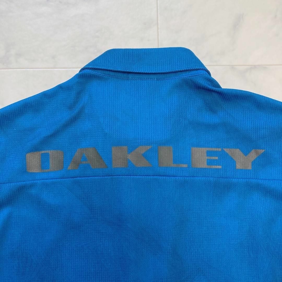 Oakley(オークリー)のOAKLEY ボタンダウン BD ブルー　ポロシャツ　メンズ　サイズXL スポーツ/アウトドアのゴルフ(ウエア)の商品写真