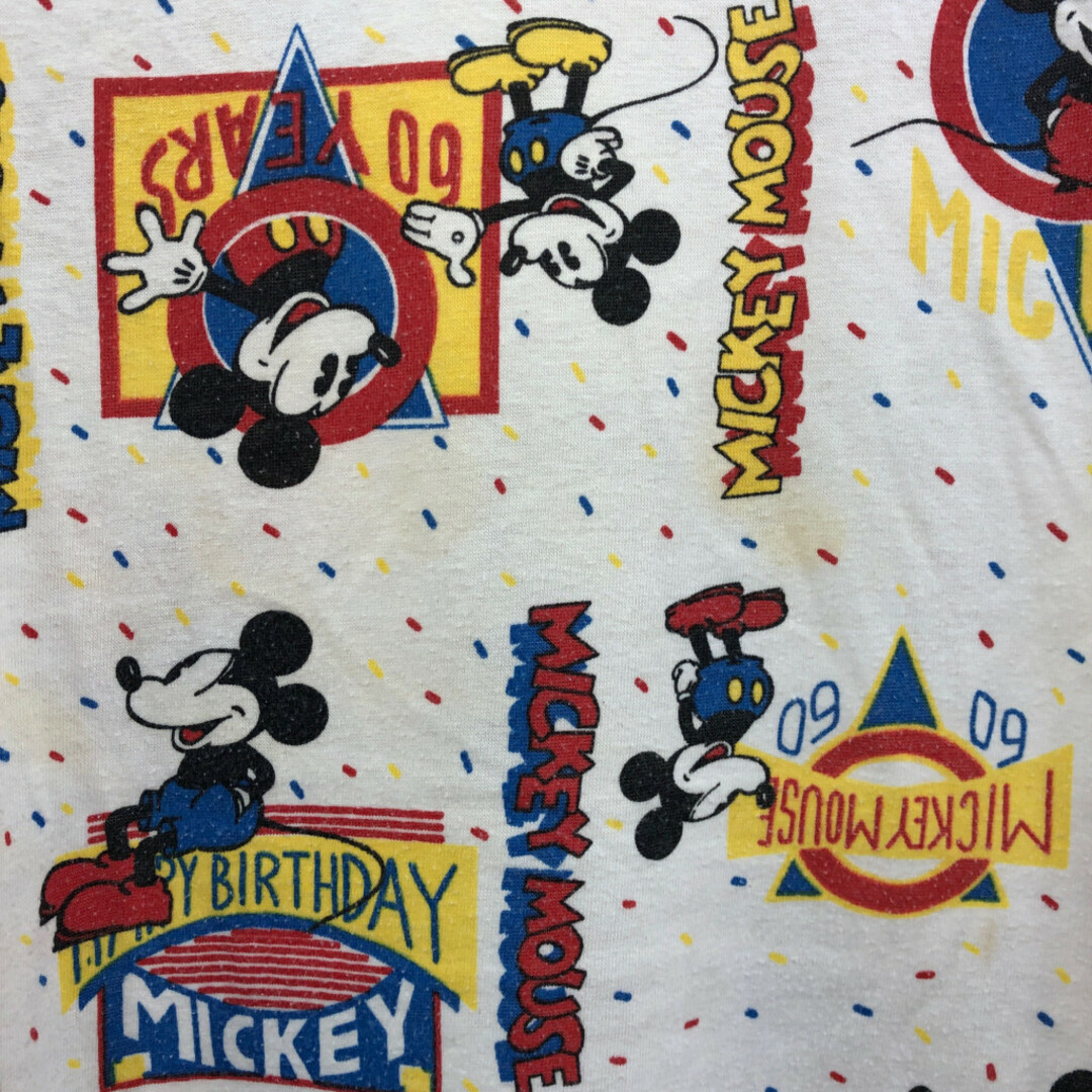 Disney(ディズニー)の90年代 Disney ディズニー NIGHT MOVES 総柄 ミッキーマウス 半袖Ｔシャツ キャラクター ホワイト (メンズ L相当) 中古 古着 Q6499 メンズのトップス(Tシャツ/カットソー(半袖/袖なし))の商品写真