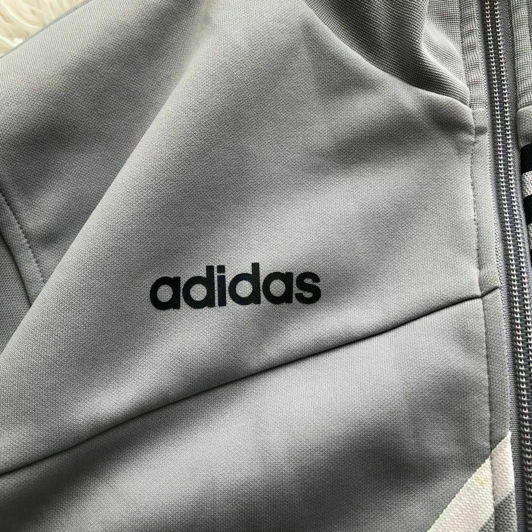 adidas(アディダス)のAdidasアディダス　トラックジャケット　ライトグレージャージ古着M メンズのトップス(ジャージ)の商品写真