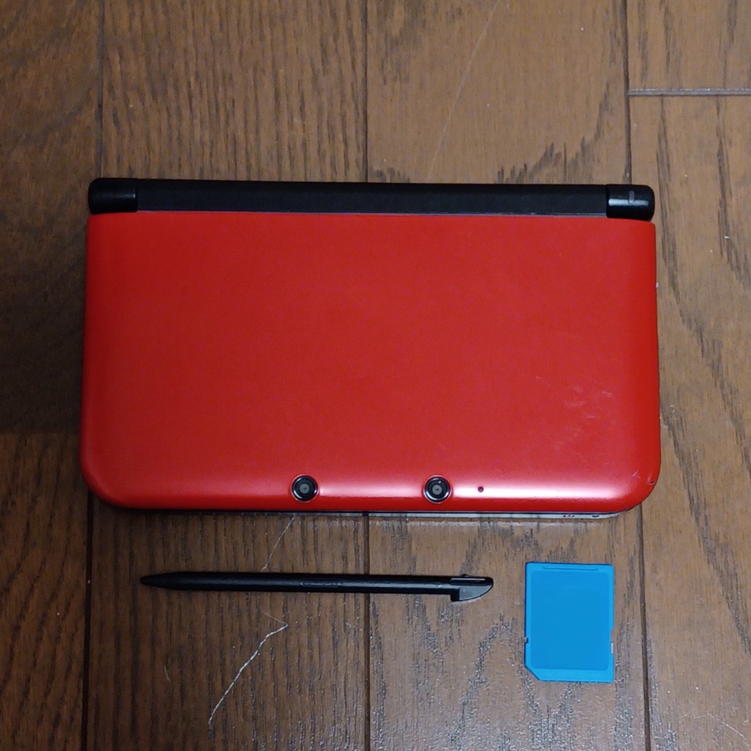 ニンテンドー3DS(ニンテンドー3DS)のニンテンドー3DS LL レッド×ブラック 中古 エンタメ/ホビーのゲームソフト/ゲーム機本体(携帯用ゲーム機本体)の商品写真