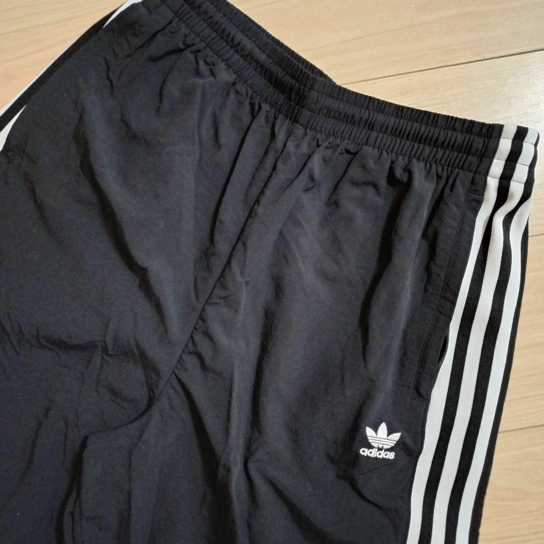 Originals（adidas）(オリジナルス)のadidas 黒 ロックアップ ウーブンパンツ ジャージ シャカパン XOT レディースのパンツ(その他)の商品写真