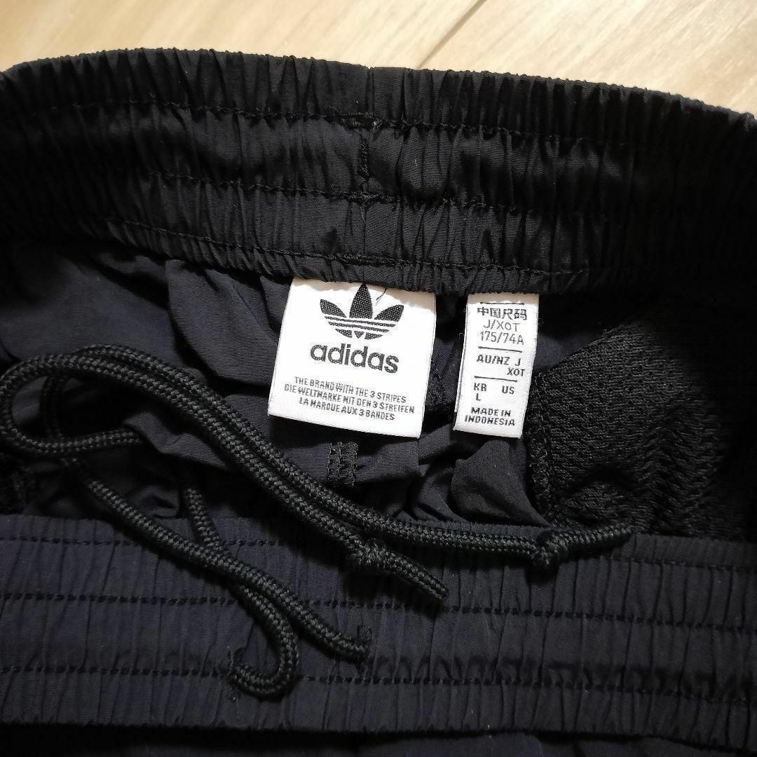 Originals（adidas）(オリジナルス)のadidas 黒 ロックアップ ウーブンパンツ ジャージ シャカパン XOT レディースのパンツ(その他)の商品写真