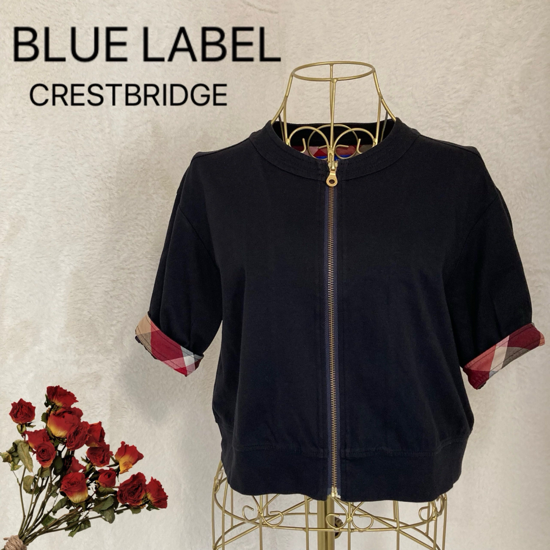 BLUE LABEL CRESTBRIDGE(ブルーレーベルクレストブリッジ)のBLUE LABEL 半袖　ブルゾン　ブラック 黒 ショート丈　コットン100% レディースのトップス(カーディガン)の商品写真