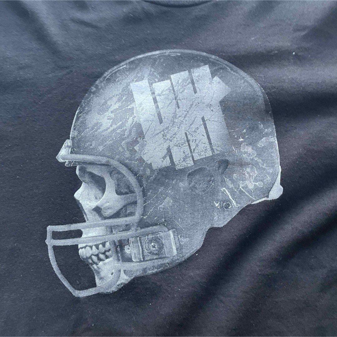 UNDEFEATED(アンディフィーテッド)のUNDEFEATED アンディフィーテッド　スカル　ラグビー　NFL  M メンズのトップス(Tシャツ/カットソー(半袖/袖なし))の商品写真