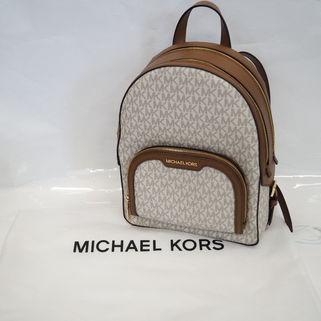 Michael Kors(マイケルコース)のTh962271 マイケルコース リュック・デイパック PVC MK総柄 ホワイト×ブラウン系 レディース Michael Kors 超美品・中古 レディースのバッグ(リュック/バックパック)の商品写真