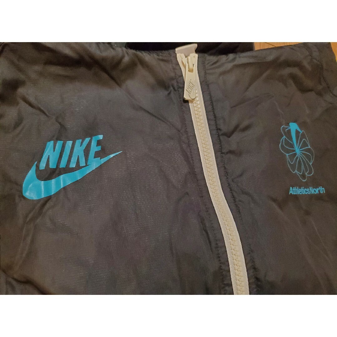 NIKE(ナイキ)のウィンドブレーカー【NIKE】athletics north 風車マーク メンズのジャケット/アウター(その他)の商品写真