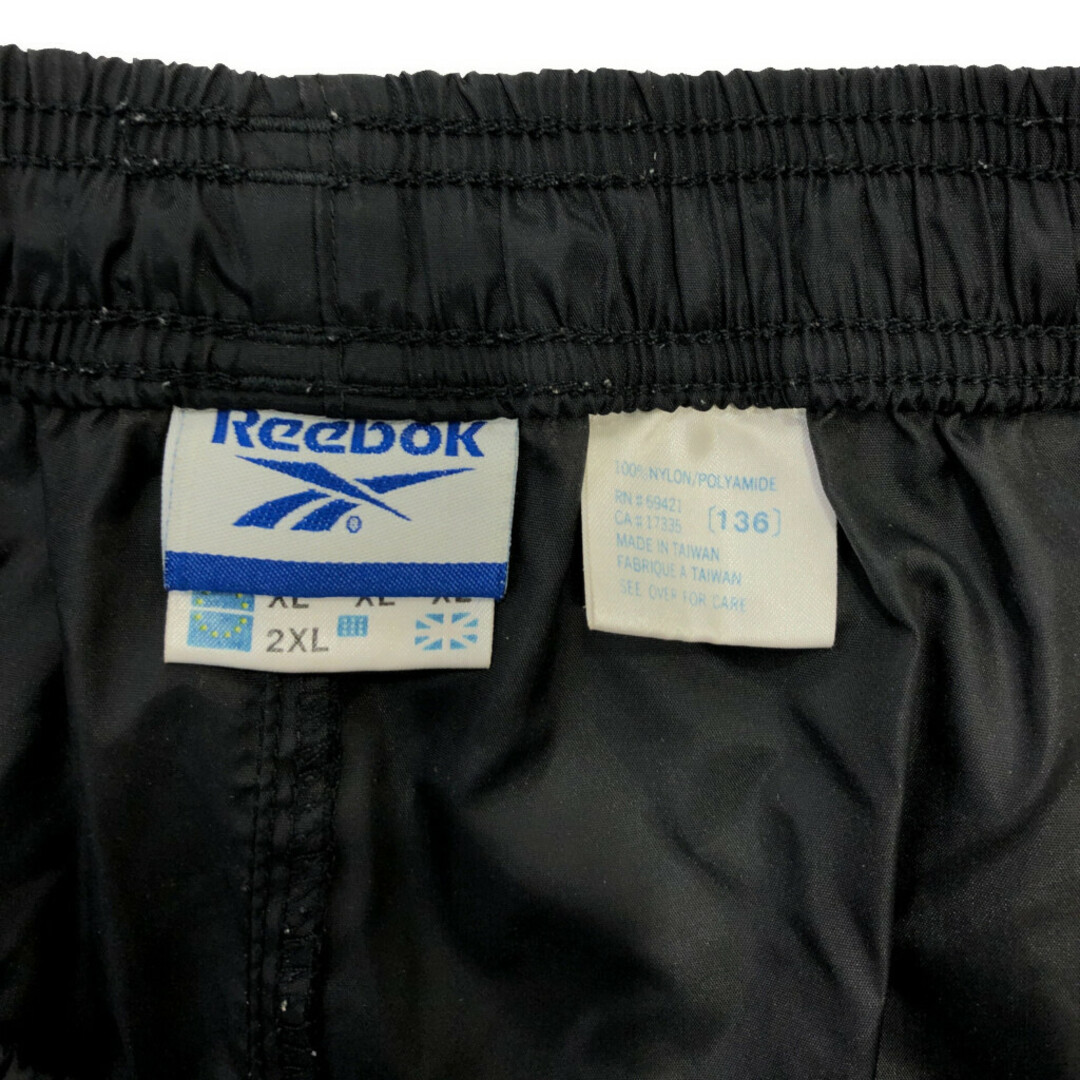 Reebok(リーボック)の90年代 Reebok リーボック ナイロンパンツ 大きいサイズ スポーツ ブラック (メンズ 2XL) 中古 古着 Q6879 メンズのパンツ(その他)の商品写真