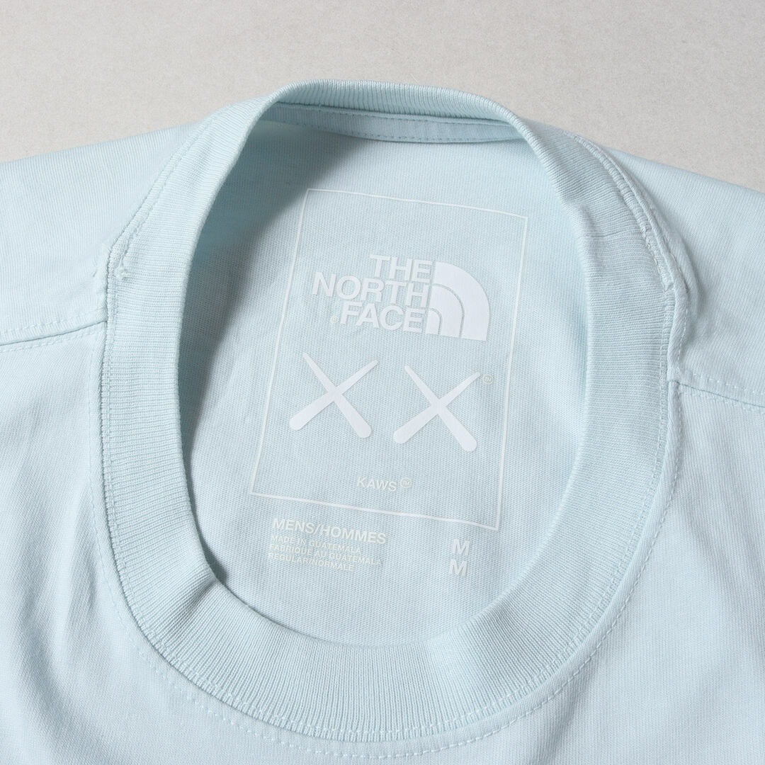 THE NORTH FACE(ザノースフェイス)の美品 THE NORTH FACE ノースフェイス Tシャツ サイズ:M 22SS 日本未発売 KAWS ロゴ刺繍 クルーネック 半袖Tシャツ Tee アイスブルー トップス カットソー コラボ【メンズ】【中古】 メンズのトップス(Tシャツ/カットソー(半袖/袖なし))の商品写真