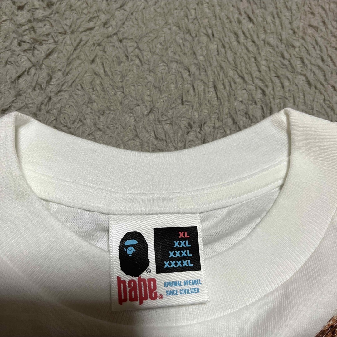 A BATHING APE(アベイシングエイプ)のAPE BAPE KAWS NFS限定　Jacob ネックレス　tシャツ　XL メンズのトップス(Tシャツ/カットソー(半袖/袖なし))の商品写真