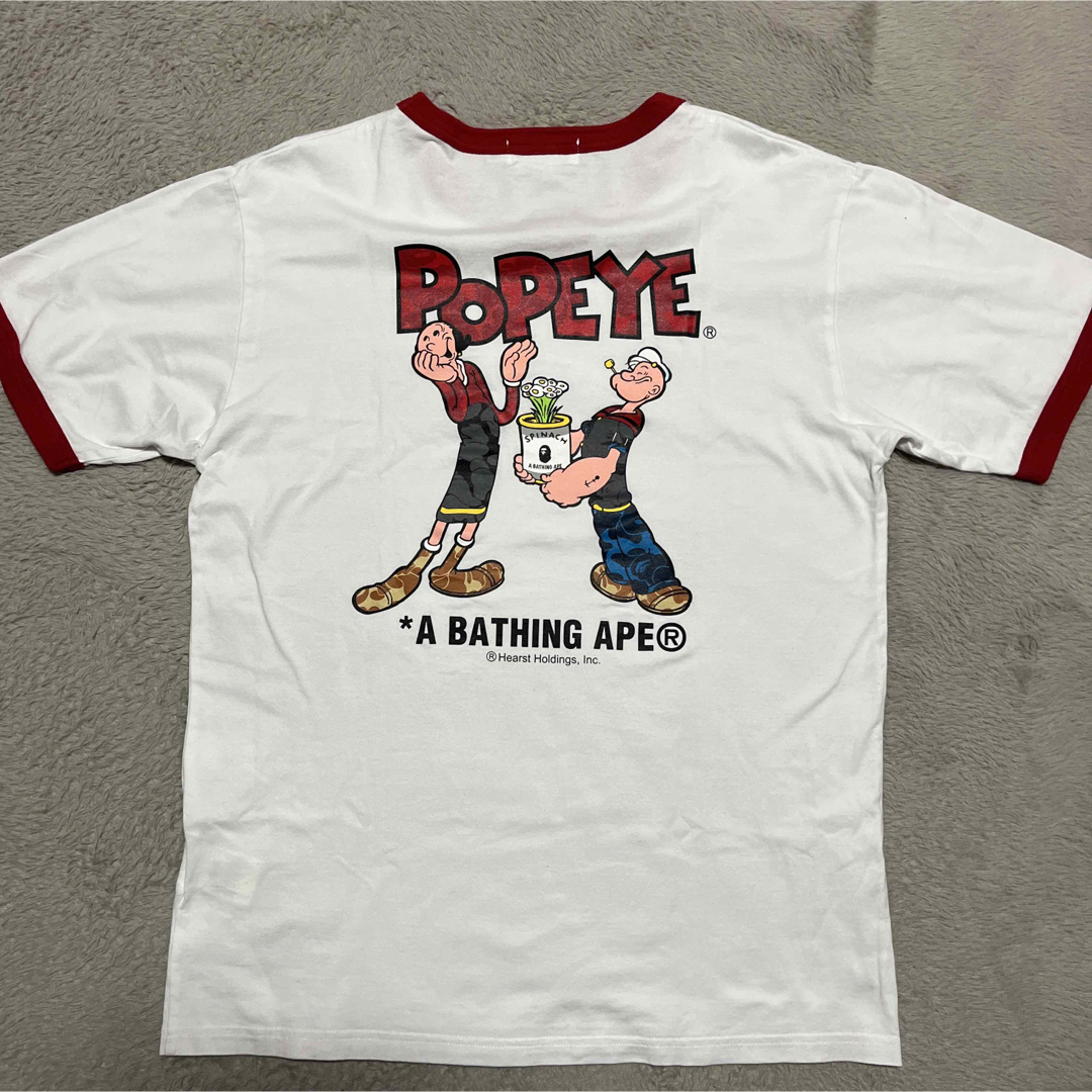 A BATHING APE(アベイシングエイプ)のAPE BAPE KAWS POPEYE リンガーtee tシャツ　ポパイ　L メンズのトップス(Tシャツ/カットソー(半袖/袖なし))の商品写真