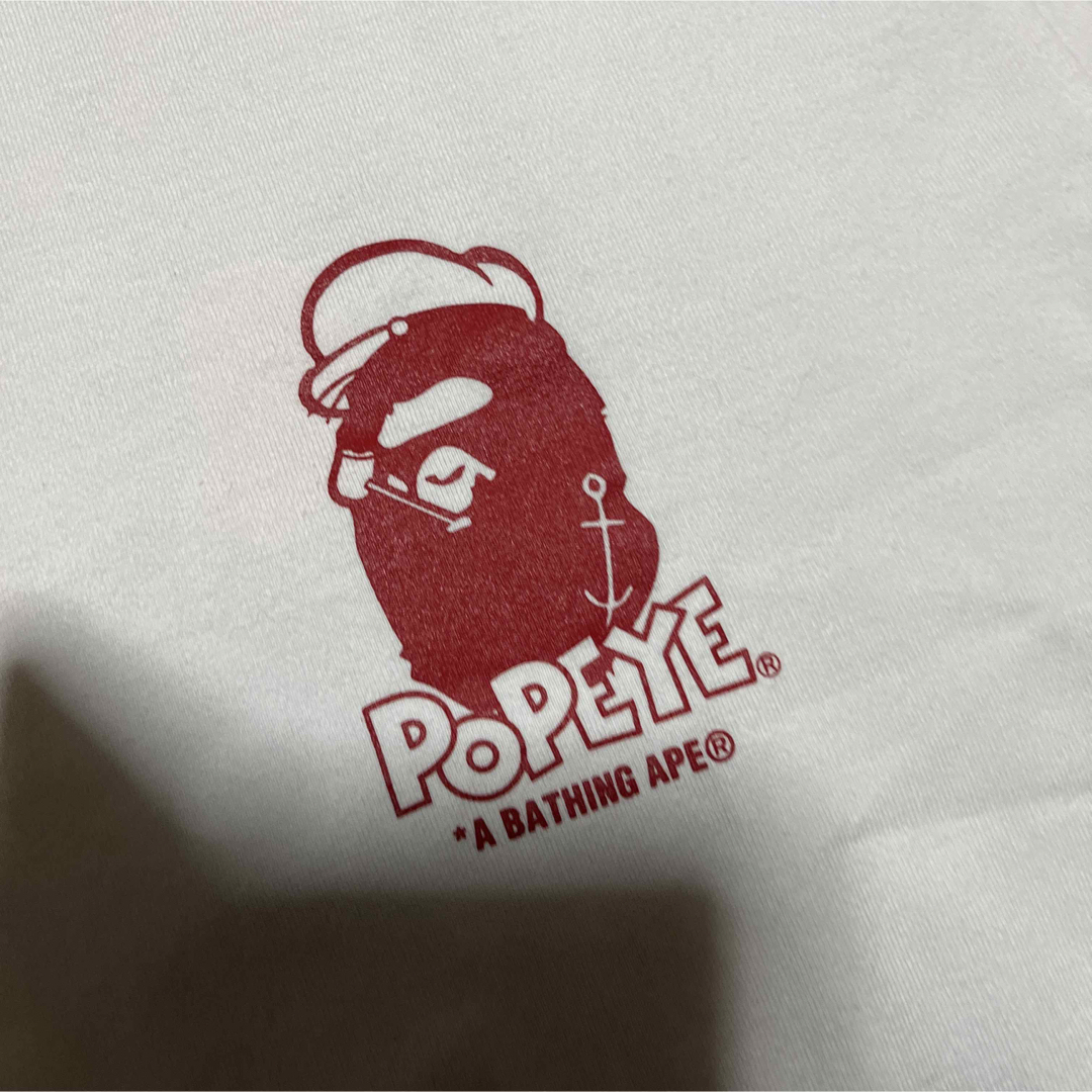 A BATHING APE(アベイシングエイプ)のAPE BAPE KAWS POPEYE リンガーtee tシャツ　ポパイ　L メンズのトップス(Tシャツ/カットソー(半袖/袖なし))の商品写真