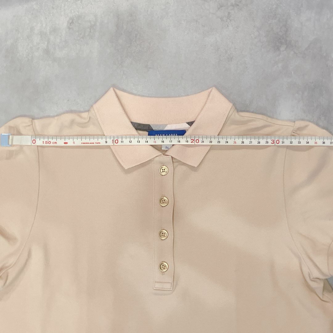 BLUE LABEL CRESTBRIDGE(ブルーレーベルクレストブリッジ)のブルーレーベル　クレストブリッジ３６ピンク　リボン　ノバチェック半袖ポロシャツ レディースのトップス(ポロシャツ)の商品写真