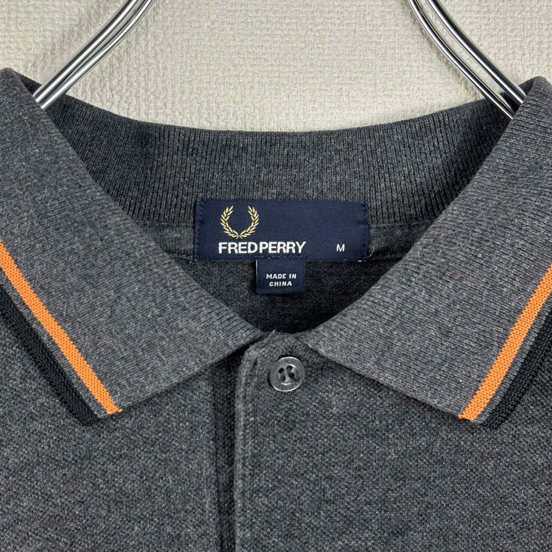 FRED PERRY(フレッドペリー)のフレッドペリー　ポロシャツ　M グレー　オレンジ　ブラック　古着 メンズのトップス(ポロシャツ)の商品写真