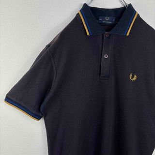 フレッドペリー(FRED PERRY)のフレッドペリー　ポロシャツ　半袖　紺金青　36 イングランド製　古着(ポロシャツ)