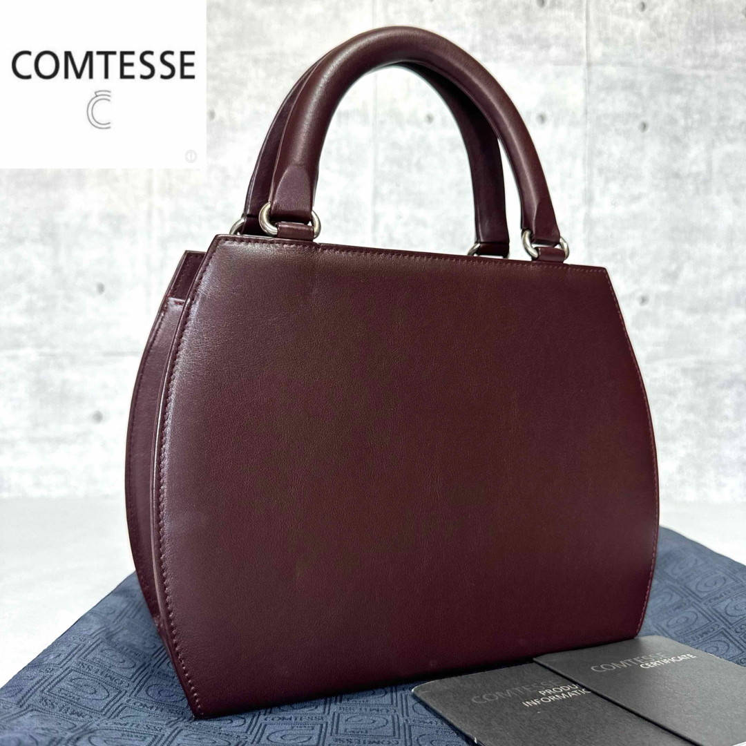 COMTESSE(コンテス)の【良品】COMTESSE カーフレザー ボルドー シルバー金具 ハンドバッグ レディースのバッグ(ハンドバッグ)の商品写真