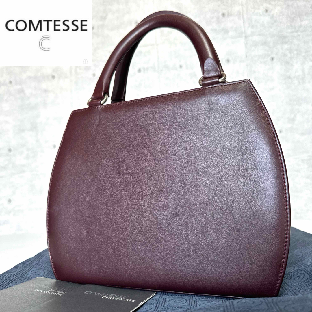 COMTESSE(コンテス)の【良品】COMTESSE カーフレザー ボルドー シルバー金具 ハンドバッグ レディースのバッグ(ハンドバッグ)の商品写真