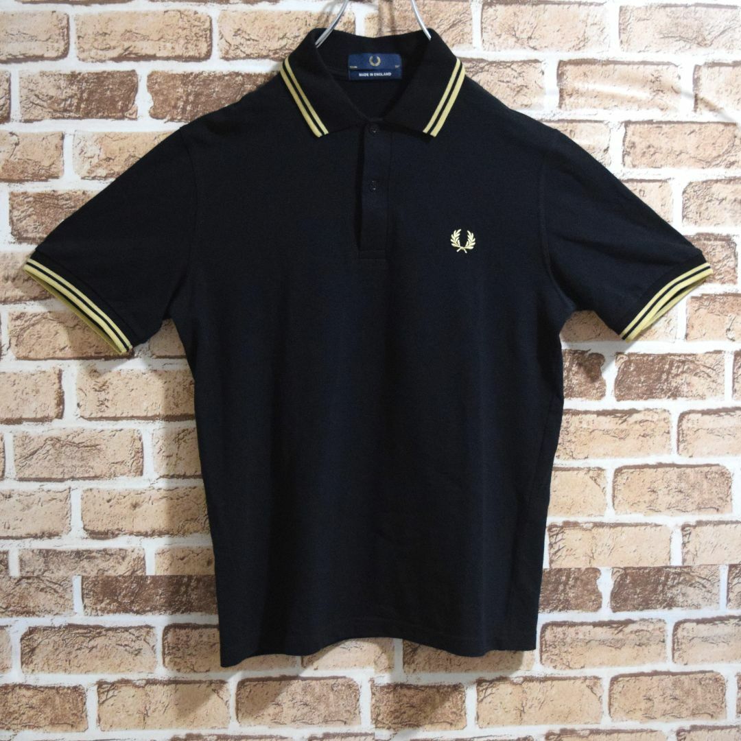 FRED PERRY(フレッドペリー)の《フレッドペリー》英国製　M12　黒×ゴールド　M相当　半袖ポロシャツ メンズのトップス(ポロシャツ)の商品写真