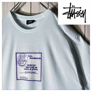 ステューシー(STUSSY)の【良品 L】ステューシー 両面プリント リップシティスケート Tシャツ 水色(Tシャツ/カットソー(半袖/袖なし))