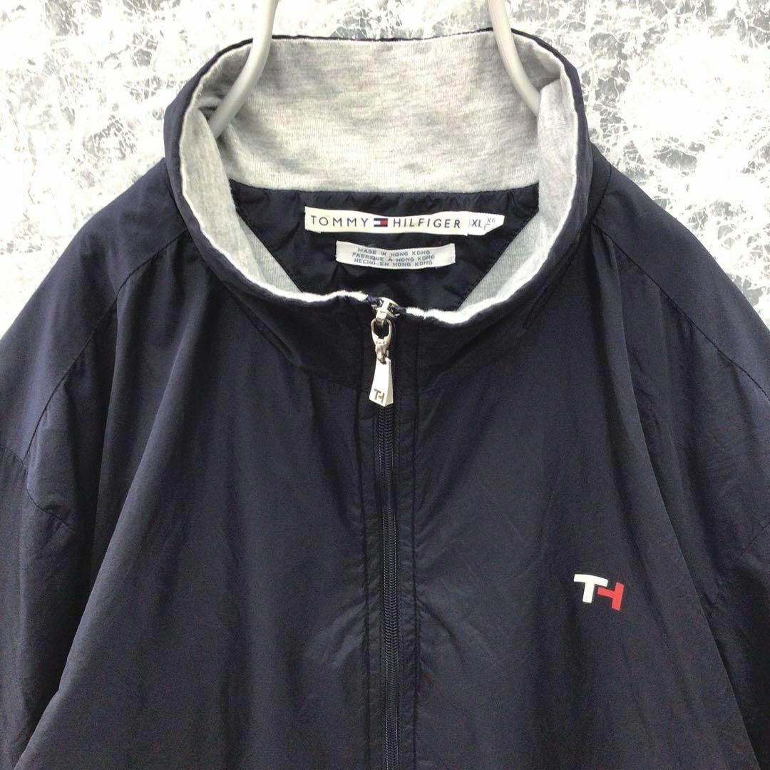 TOMMY HILFIGER(トミーヒルフィガー)のK298 USA古着トミーヒルフィガープリントロゴナイロントラックジャケット希少 メンズのジャケット/アウター(ナイロンジャケット)の商品写真