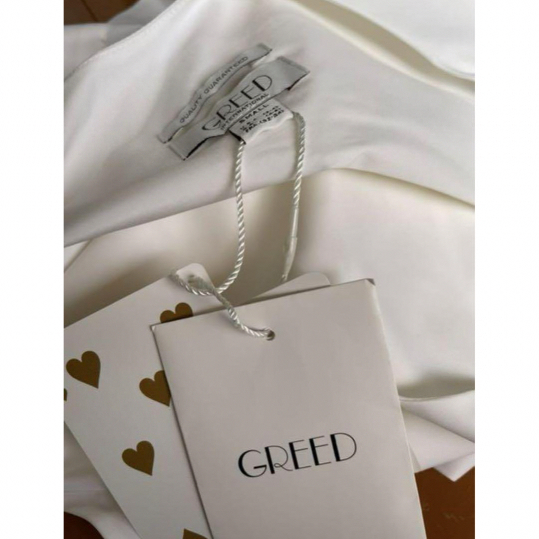 GREED(グリード)のグリード 新品ホワイトフリルトップス A102 レディースのトップス(Tシャツ(半袖/袖なし))の商品写真
