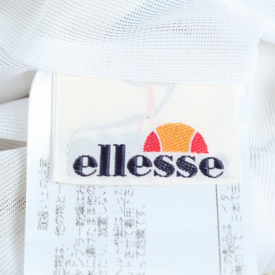 ellesse(エレッセ)のエレッセ パンツ ボトムス サイドライン ウィンドブレーカー スポーツウエア メンズ Sサイズ ベージュ×白 ellesse メンズのパンツ(その他)の商品写真