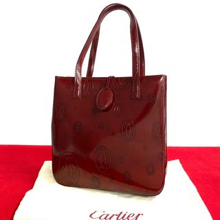 カルティエ(Cartier)のほぼ 未使用 袋付き CARTIER カルティエ ハッピーバースデー 柄 パテント レザー 本革 ハンドバッグ ミニ トートバッグ ボルドー 26505(ハンドバッグ)