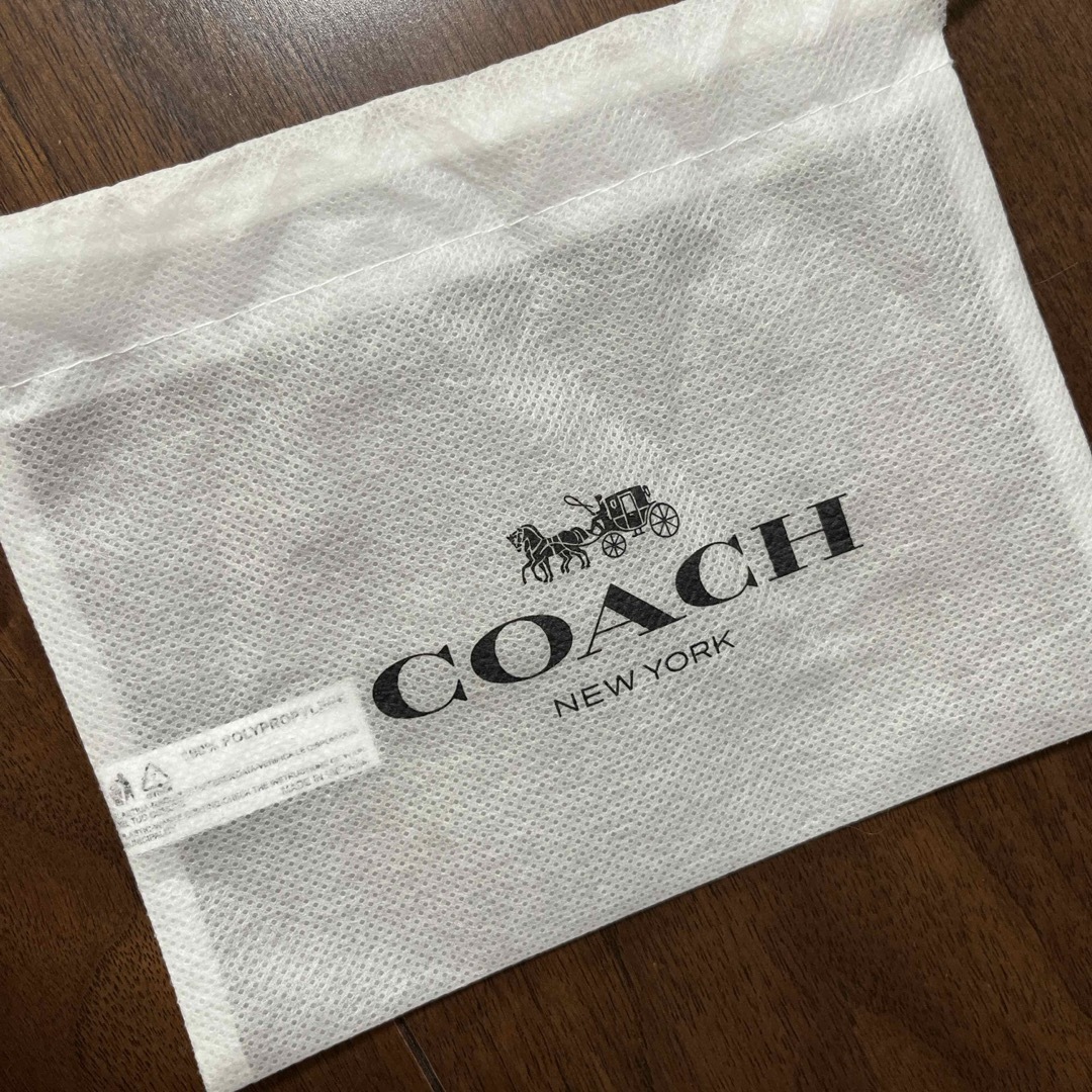 COACH(コーチ)のコーチ　不織布保管袋　巾着 ハンドメイドのファッション小物(ポーチ)の商品写真