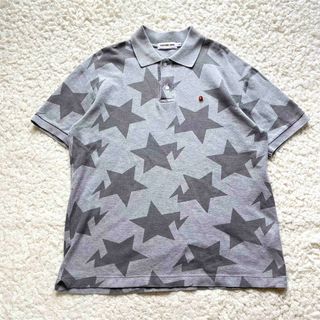 アベイシングエイプ(A BATHING APE)のAPE BAPE KAWS STA ベイプスタ　ポロシャツ　camo tシャツ(ポロシャツ)