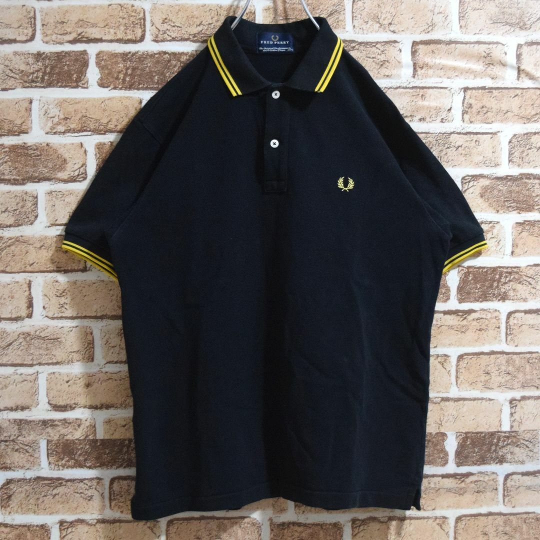 STUSSY(ステューシー)の《フレッドペリー》日本製　刺繡ロゴ　黒×イエロー　L　半袖ポロシャツ メンズのトップス(ポロシャツ)の商品写真