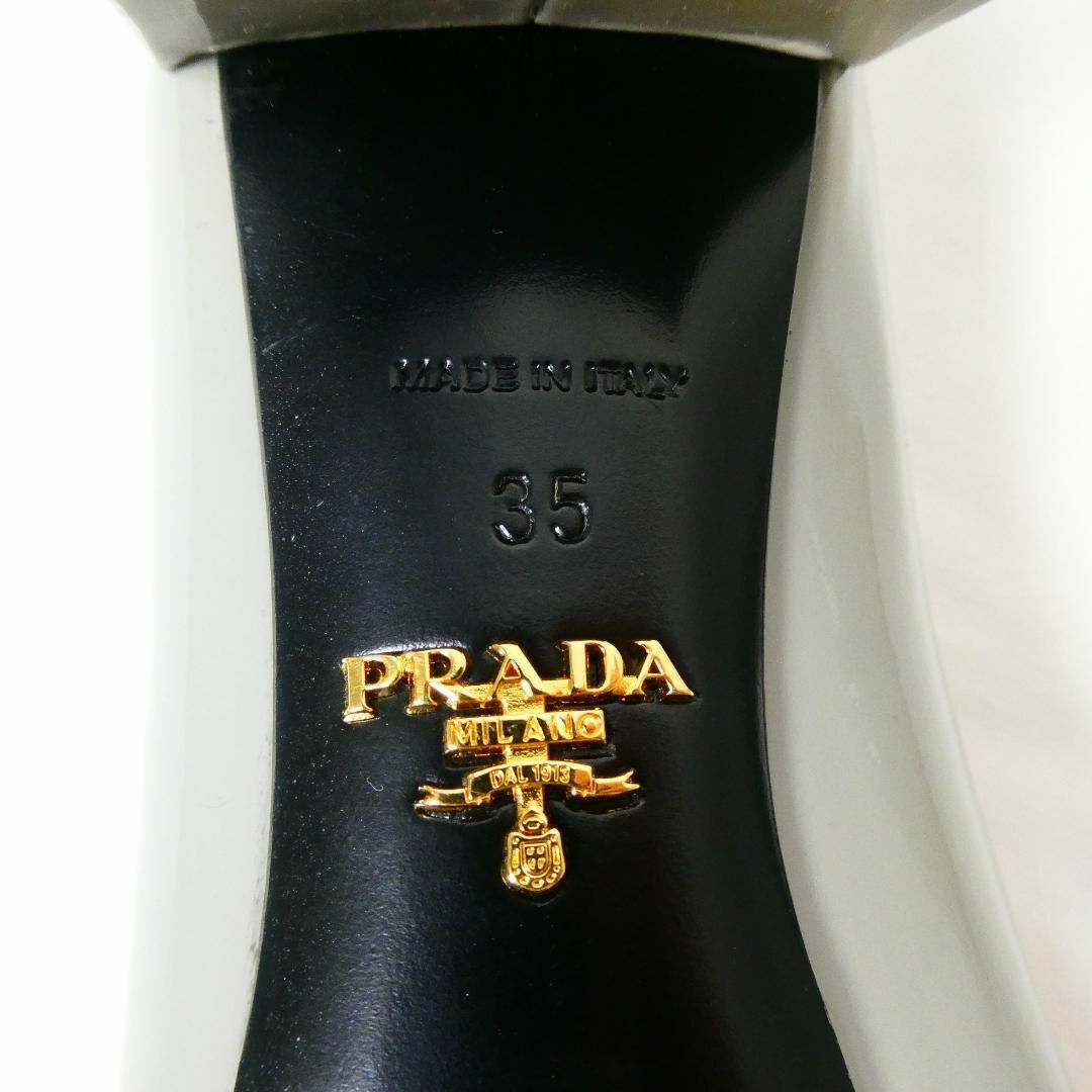 PRADA(プラダ)のほぼ美品 PRADA エナメル バックル ラウンドトゥ パンプス レディースの靴/シューズ(ハイヒール/パンプス)の商品写真