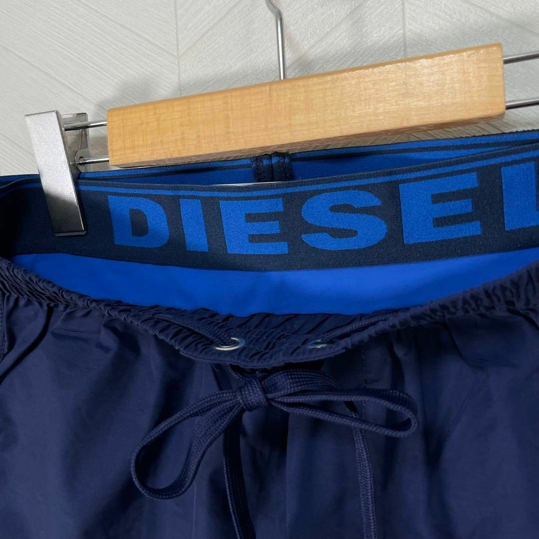 DIESEL(ディーゼル)の新品 タグ付き 水着 水陸両用 サーフパンツ ショートパンツ 重ねばき風 メンズ メンズの水着/浴衣(その他)の商品写真