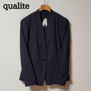 カリテ(qualite)のqualite　カリテ　レディース　ノーカラー　ジャケット　濃紺　未使用タグ付き(ノーカラージャケット)