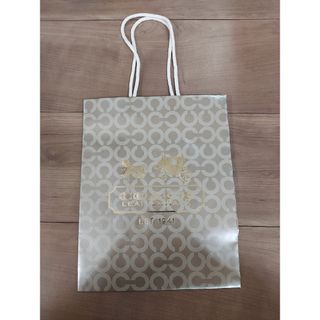 コーチ(COACH)のCOACH　紙袋　ゴールド　１枚(ショップ袋)