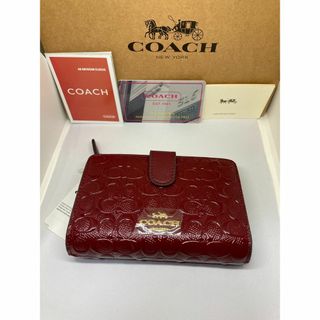 コーチ(COACH)のCOACH　コーチ　F25937　二つ折り財布　デボスド　パテントレザーチェリー(財布)