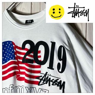 ステューシー(STUSSY)の【コラボ M】ステューシー CPFM 両面ロゴ 凹凸 星条旗 ロンT 白(Tシャツ/カットソー(七分/長袖))