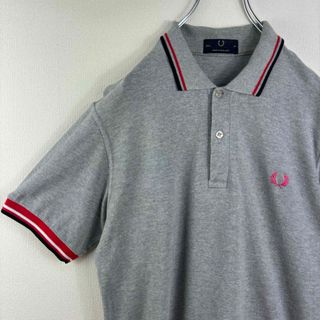 フレッドペリー(FRED PERRY)のフレッドペリー　ポロシャツ　半袖　英国製　38 M グレー　ピンク　古着(ポロシャツ)