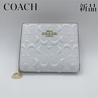 コーチ(COACH)のCOACH シグネチャー エンボス加工 2つ折り財布 ホワイト(財布)