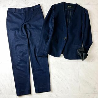 ユナイテッドアローズグリーンレーベルリラクシング(UNITED ARROWS green label relaxing)のグリーンレーベル 麻 綿 M ノーカラー セットアップ ネイビー パンツスーツ(スーツ)