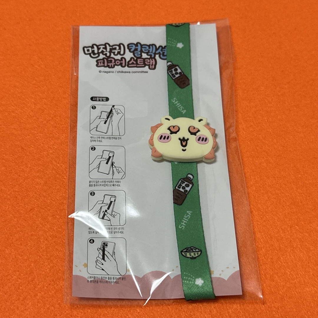 ちいかわ(チイカワ)のシーサー スマホハンドストラップ バンド エンタメ/ホビーのおもちゃ/ぬいぐるみ(キャラクターグッズ)の商品写真