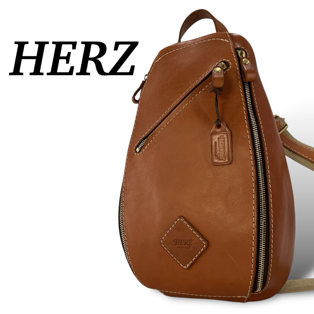 HERZ - 美品 ヘルツ ボディバッグ トリプルファスナー ロゴ型 HERZ - 美品 ヘルツ ボディバッグ トリプルファスナー ロゴ型