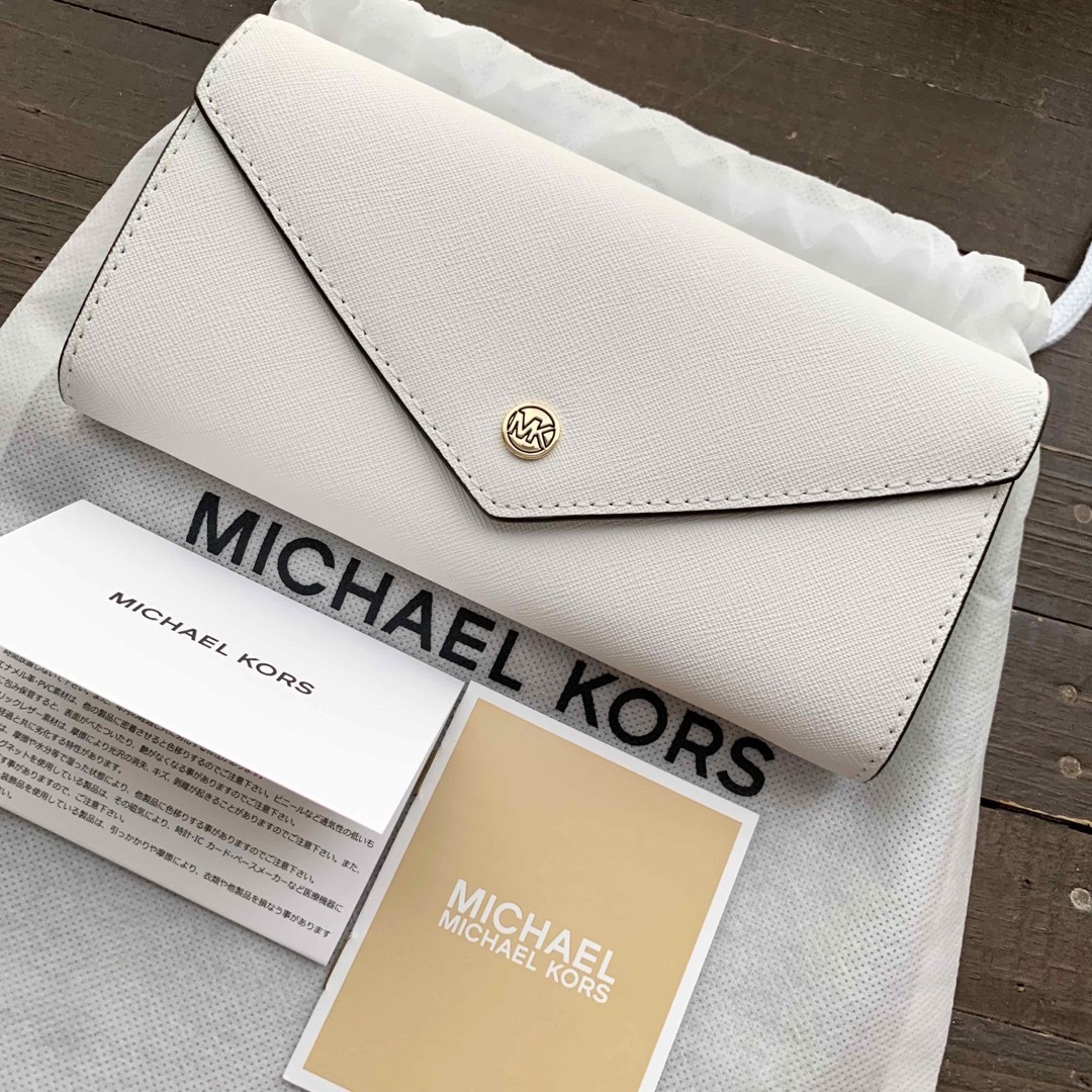 MICHAEL KORS - 新品未使用 マイケルコース 長財布 フラップ 白 MICHAEL KORS - 新品未使用 マイケルコース 長財布 フラップ 白