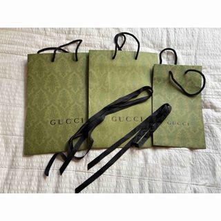 GUCCI - 新品.本物】 GUCCI グッチ 紙袋 ショップ袋 黒 2枚の GUCCI - 新品.本物】 GUCCI グッチ 紙袋 ショップ袋 黒 2枚の