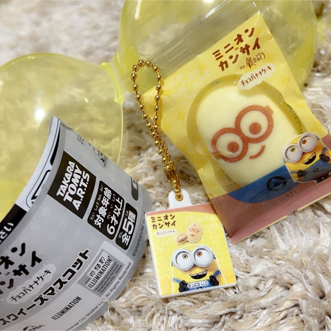 ミニオン(ミニオン)のミニオン in カンサイ チョコバナナケーキ スクイーズマスコット エンタメ/ホビーのおもちゃ/ぬいぐるみ(キャラクターグッズ)の商品写真
