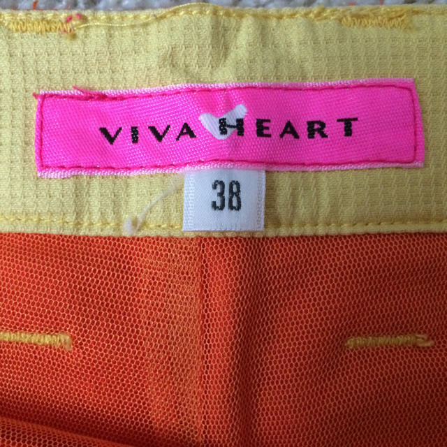 VIVA HEART(ビバハート)の値下げ★ビバハート中古ウェア フリルスカート&パンツ オレンジ色 スポーツ/アウトドアのゴルフ(ウエア)の商品写真